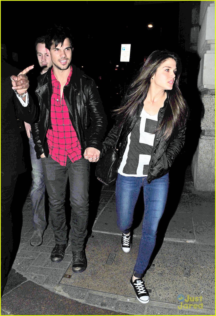 taylor lautner marie avgeropoulos matching jackets london 25